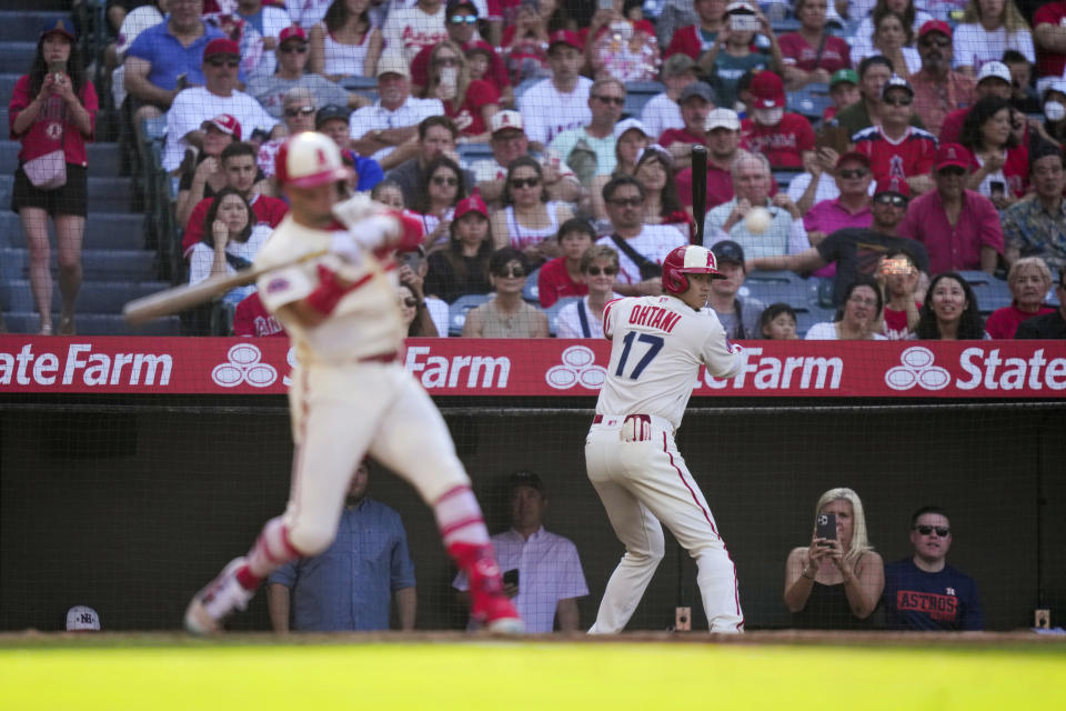 Los Angeles Angels designated hitter Shohei Ohtani (17) watches a pitch to Zach Neto during the third inning of a baseball game against the Houston Astros in Anaheim, Calif., Sunday, July 16, 2023. (AP Photo/Eric Thayer)