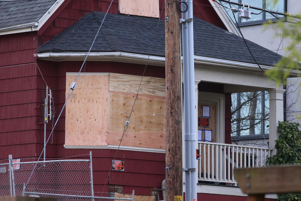 This Tuesday, Dec. 8, 2020 photo shows a home on North Mississippi Avenue in Portland, Ore. where protesters have camped to prevent a Black and Indigenous family from being forced to leave the foreclosed home, which has been dubbed the “Red House on Mississippi”. (Beth Nakamura/The Oregonian via AP)