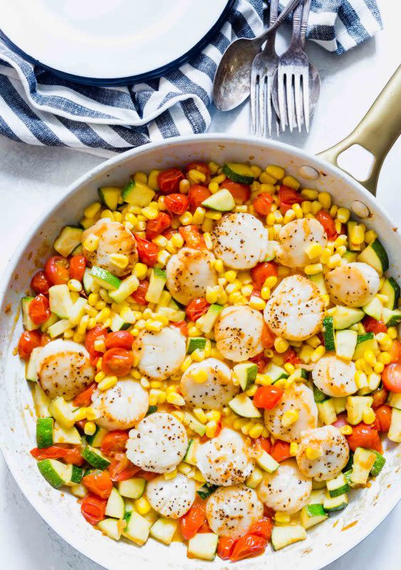 <p>Table for Two</p><p>Scallops and summer vegetables are the perfect combinations for a light and quick weeknight meal!</p><p><strong>Get the recipe: <a href="https://www.tablefortwoblog.com/scallops-and-summer-vegetable-skillet/" rel="nofollow noopener" target="_blank" data-ylk="slk:Scallops and Summer Vegetable Skillet;elm:context_link;itc:0;sec:content-canvas" class="link rapid-noclick-resp">Scallops and Summer Vegetable Skillet</a></strong></p>