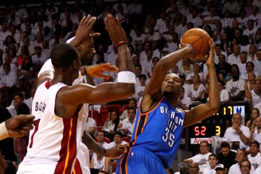 Oklahoma City Thunder's Kevin Durant attempts a shot as Miami Heat's Chris Bosh (L) defends during game four of their 2012 NBA Finals on June 19. Durant had 28 points for the Thunder