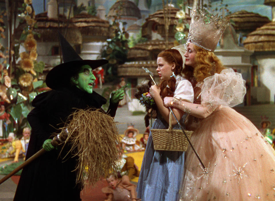 judy garland as dorothy, margaret hamilton as the wicked witch of the west, and billie burke as glinda the good witch in the wizard of oz