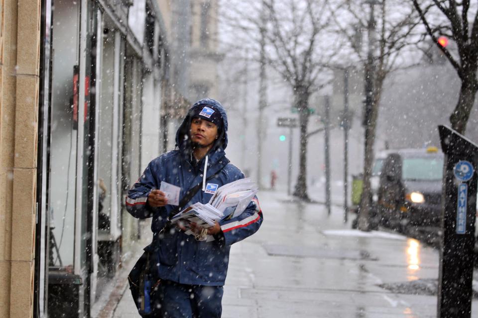 Mail carrier Adinson Sanchez in Poughkeepsie, N.Y., in 2018.
