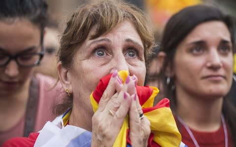 Pro-independence supporters react as they wait to hear the result of the vote on friday - Credit: Bloombger