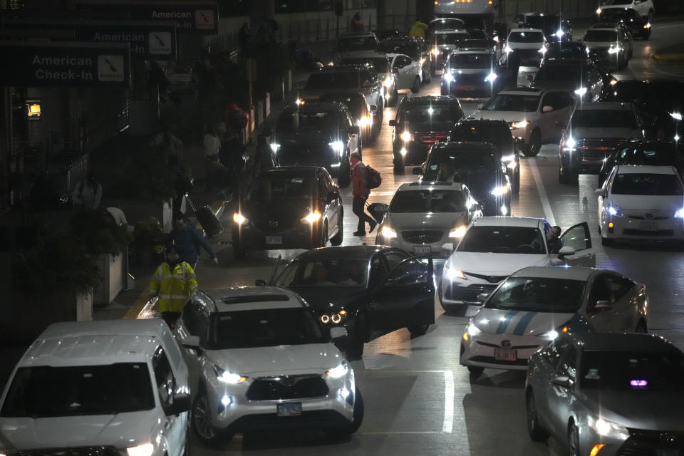 Heavy traffic is seen at O'Hare International Airport in Chicago, Thursday, Dec. 21, 2023. It's beginning to look a lot like a hectic holiday travel season, but it might go relatively smoothly if the weather cooperates. (AP Photo/Nam Y. Huh)