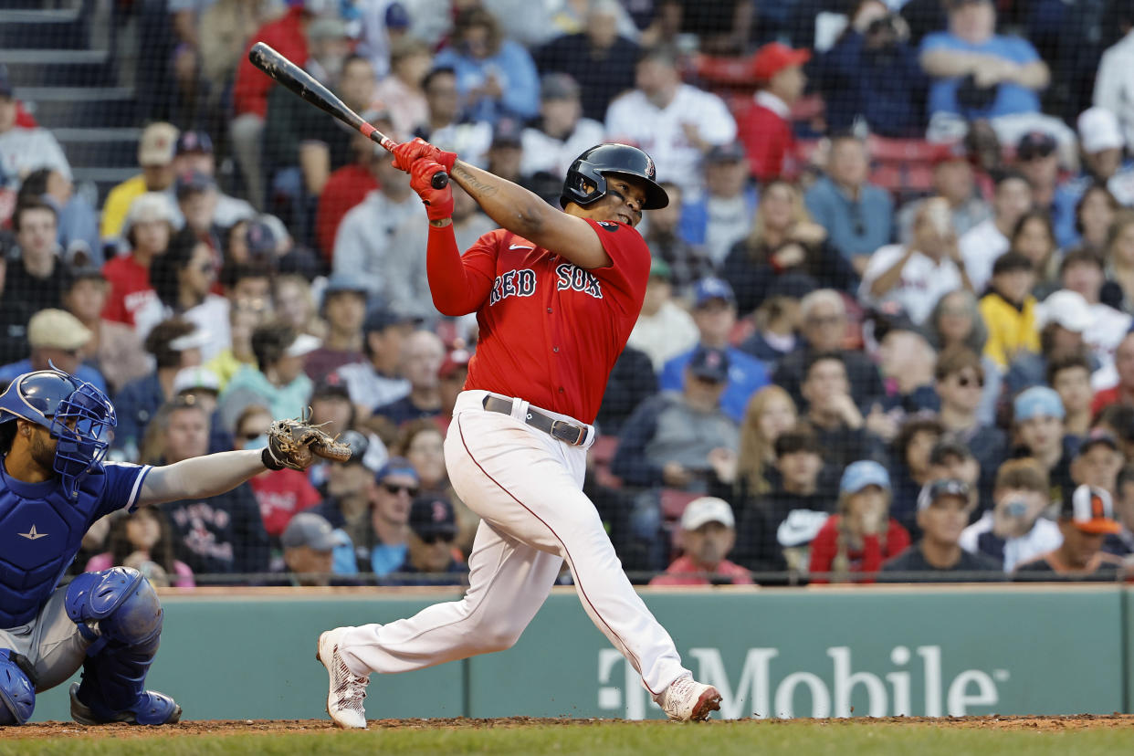BOSTON, MA - SEPTEMBER 17: Rafael Devers #11 of the Boston Red Sox follows through on a hit against the Kansas City Royals during the sixth inning at Fenway Park on September 17, 2022 in Boston, Massachusetts. (Photo By Winslow Townson/Getty Images)