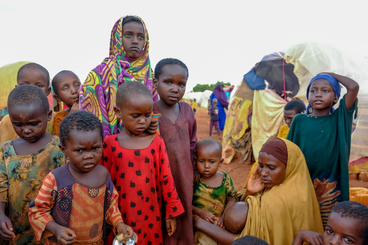 A mother and children displaced by drought in Somalia in October 2022 (AP)