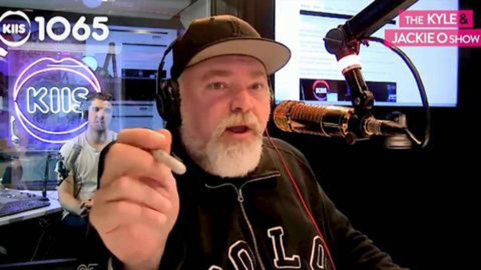 Kyle Sandilands virgin mary 'dumb as dog sh*t' gag breaches acma standards investigation find (pictured: Kyle Sandilands in KIIS FM recording booth looking stressed)