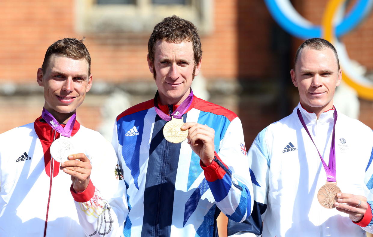 Olympics - London 2012 Olympic Games - London - 1/8/12  Cycling - Road - Men's Individual Time Trial - (From L-R) Germany's Tony Martin - Silver, Great Britain's Bradley Wiggins - Gold and Great Britain's Chris Froome - Bronze celebrate with their medals after the race. Bradley Wiggins is now the most successful British Olympian of all time after winning his seventh medal  Mandatory Credit: Action Images / Paul Childs  Livepic  PLEASE NOTE: FOR EDITORIAL USE ONLY