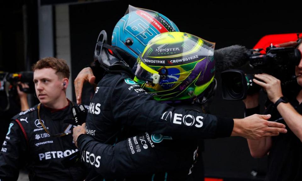 Russell and Lewis Hamilton embrace after the race