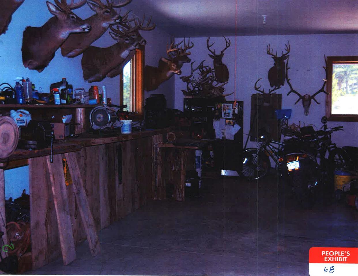 The inside of the Morphew family's garage with Barry's collection of deer heads and a pile of antlers. / Credit: Chaffee County District Court