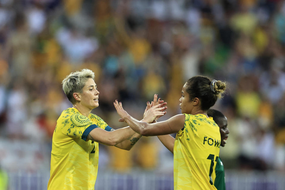 Michelle Heyman celebrates scoring with Mary Fowler.