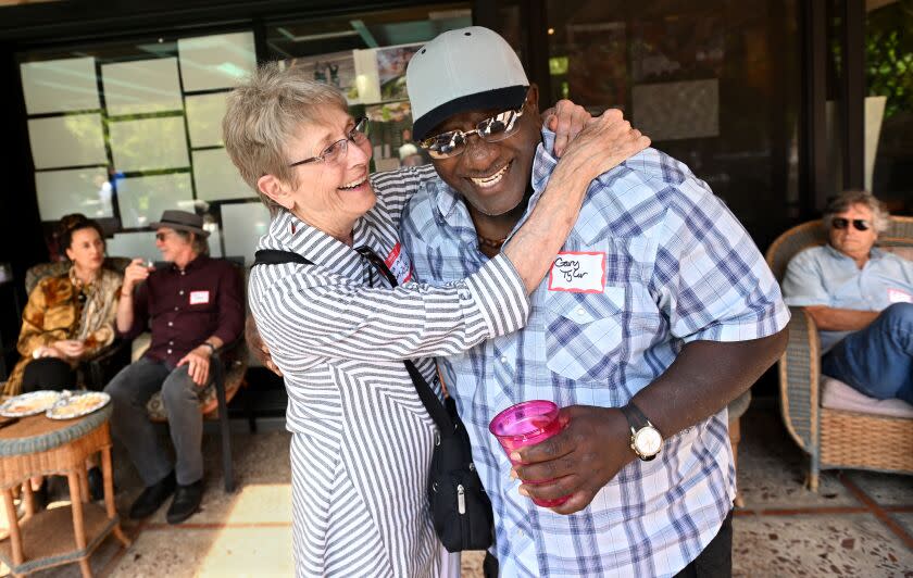 Santa Monica, California July 16, 2023-Gary Tyler hugs friend Tekla Miller during a reunion party in Santa Monica. In the 1970's the radical newspaper, The Red Tide, played a role in a decades-long fight to free Tyler who spent 41 years in prison on death row. (Wally Skalij/Los Angles Times)