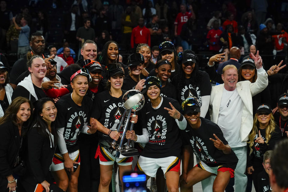 The Las Vegas Aces celebrate with the WNBA championship trophy after beating the New York Liberty in Game 4 of the Finals on Oct. 18, 2023, in New York. (AP Photo/Frank Franklin II)