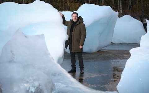 Olafur Eliasson with his Ice Watch installation outside Tate Modern - Credit: Matt Alexander/PA Wire