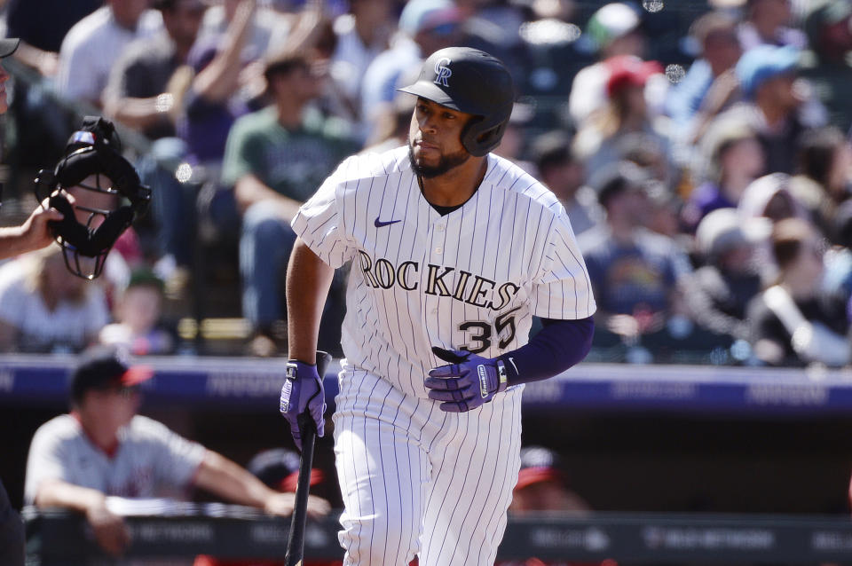 Colorado Rockies' Elias Diaz looks to the dugout after hitting a home run in the fourth inning of a baseball game Sunday, April 9, 2023, in Denver. (AP Photo/Geneva Heffernan)