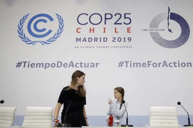 Miss Thunberg, right, and Luisa Neubauer arrive for a news conference at the COP25 Climate summit in Madrid