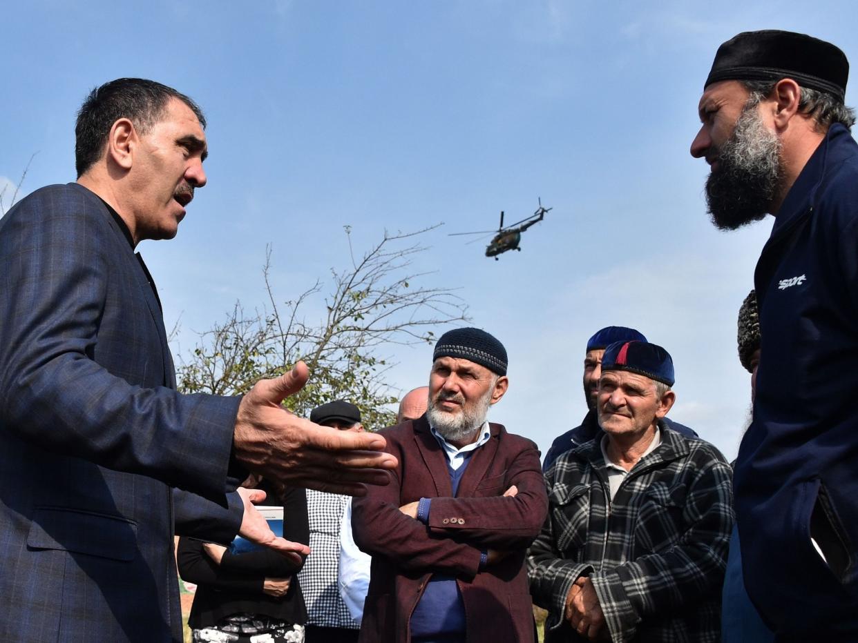 Ingushetia's leader Yunus-Bek Yevkurov, left, speaks to locals in Dattykh, near the new border with Chechnya: AFP/Getty