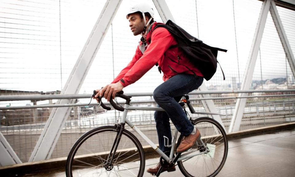 A man on a bike commuting to work.