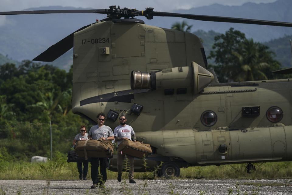 Team Rubicon's disaster response members unload aid at the airport to take to the hospital where they are treating residents injured in the 7.2 magnitude earthquake in Les Cayes, Haiti, Thursday, Aug. 19, 2021. (AP Photo/Fernando Llano)