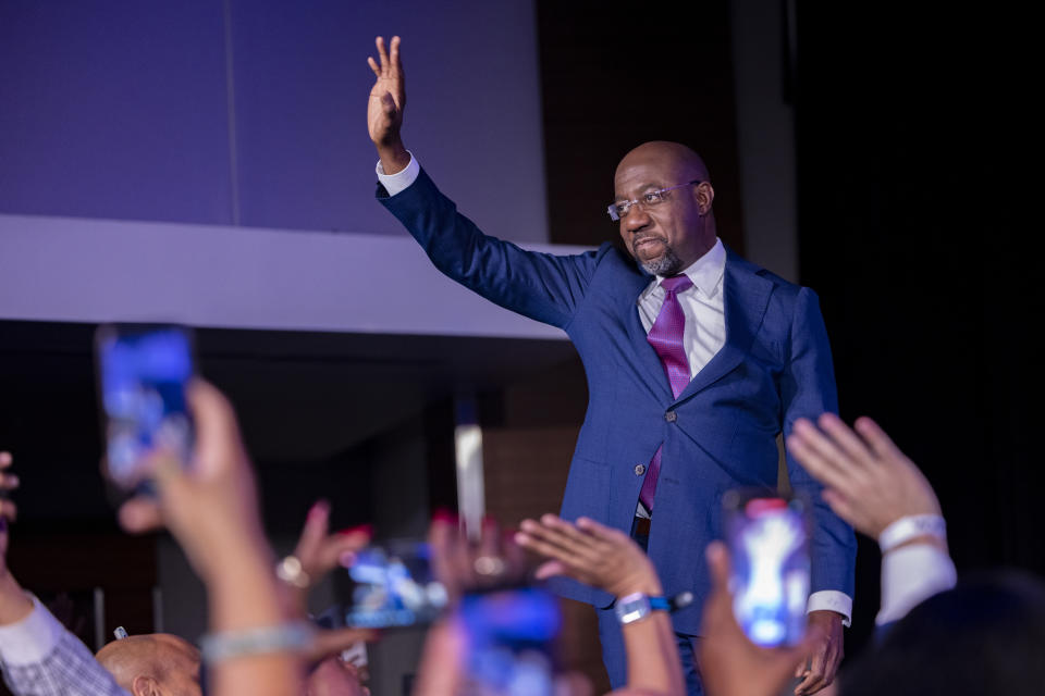 Warnock arrives to deliver a victory speech at his election night party in Atlanta on Dec. 6. 