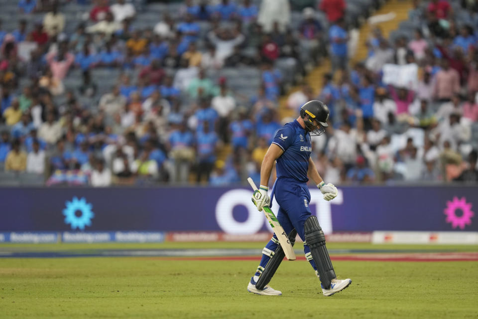 England's captain Jos Buttler leaves the ground after losing his wicket during the ICC Men's Cricket World Cup match between England and Netherlands in Pune, India, Wednesday, Nov. 8, 2023. (AP Photo/Rafiq Maqbool)