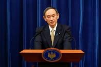 FILE PHOTO: Japan's PM Suga holds a news conference in Tokyo