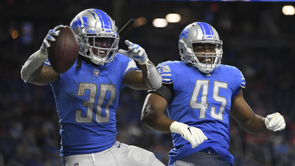 Detroit Lions running back Jamaal Williams (30) celebrates his touchdown run with Jason Cabinda (45) in the second half of an NFL football game against the San Francisco 49ers in Detroit, Sunday, Sept. 12, 2021. (AP Photo/Lon Horwedel)