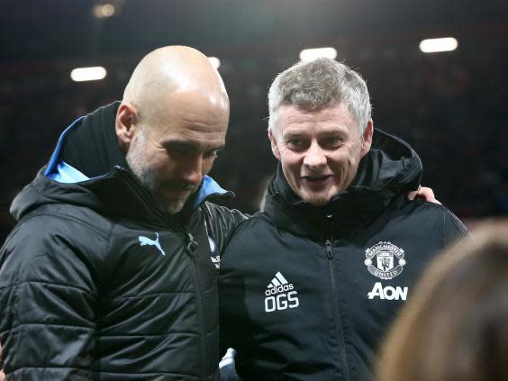 Solskjaer chats with Guardiola pre-game (Getty)