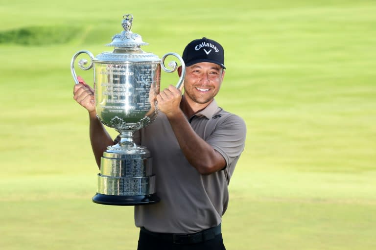 American Xander Schauffele hoists the Wanamaker Trophy after winning the PGA Championship for his first major title (Patrick Smith)