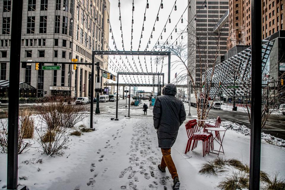 People walk around in downtown Detroit even with frigid 7-degree temperatures and a 12 mph wind chill making it feel like minus 8 degrees on Tuesday, Jan. 16, 2024. For much of Tuesday, expect high temperatures in the single digits in metro Detroit, and nighttime lows at or below zero, National Weather Service meteorologists said. A wind chill advisory has been issued, starting at 7 p.m. and lasting until noon Wednesday.