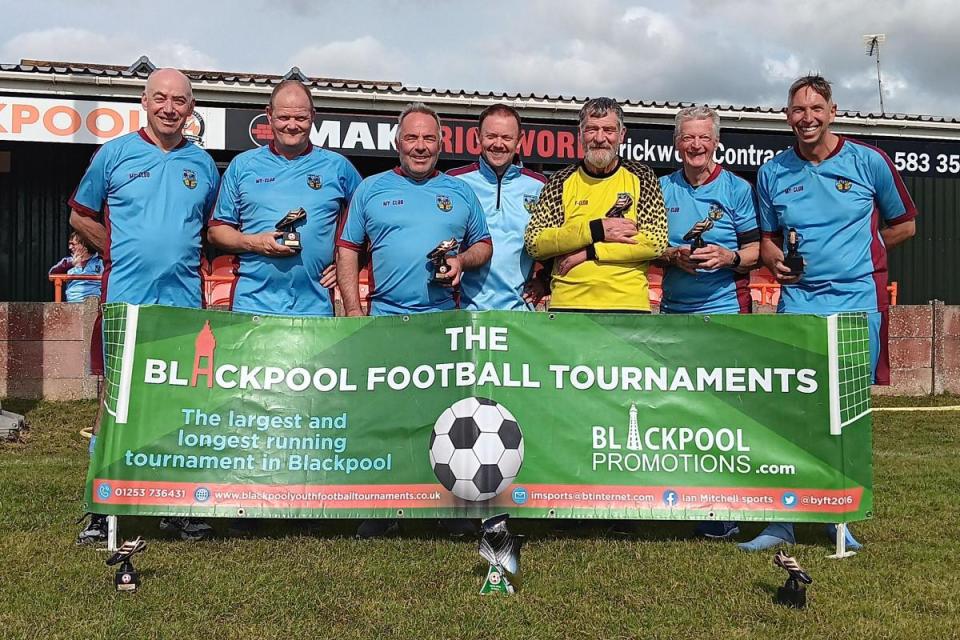 Weymouth Blues pose with the trophy in Blackpool after winning the Europa Conference Cup <i>(Image: WEYMOUTH WALKING FC)</i>