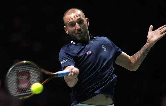 Dan Evans hits a forehand 