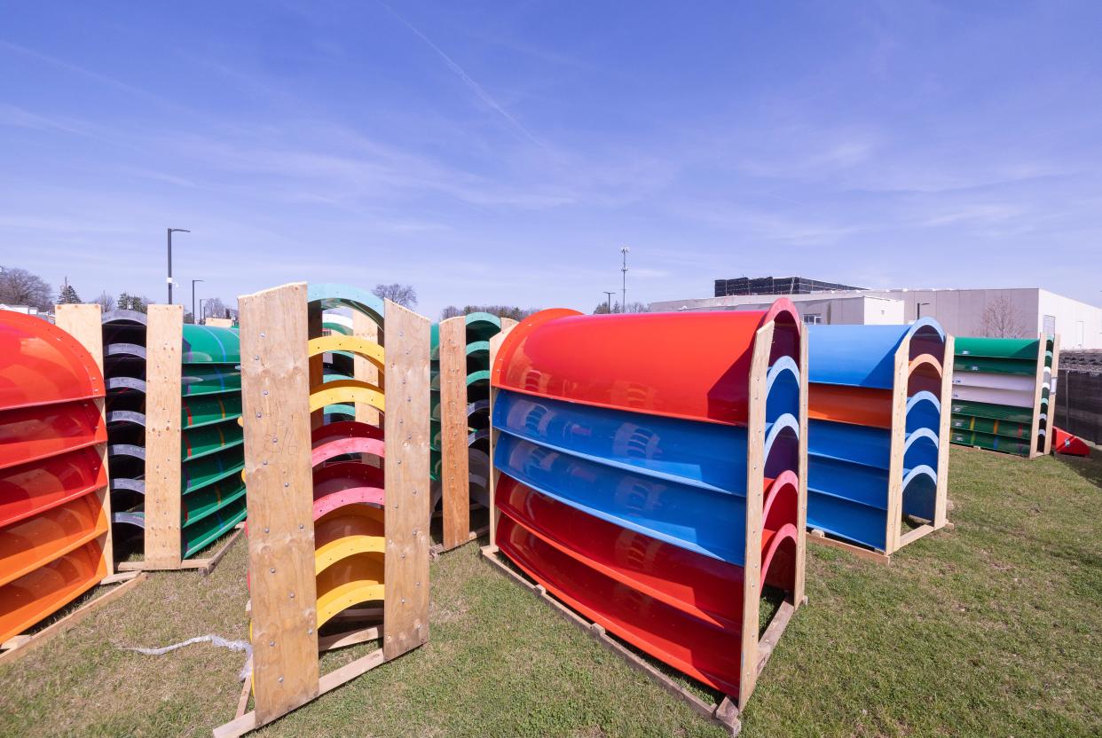 Water slide materials sit in a parking lot adjacent to the future Gameday Bay water park at the Hall of Fame Village in Canton. Work on the water park project has slowed.