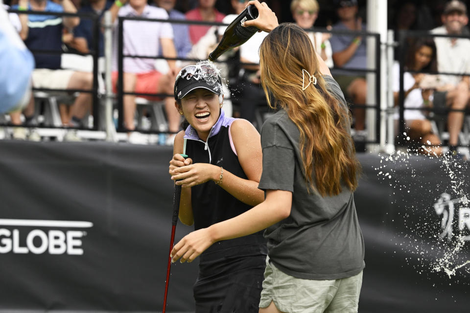 Andrea Lee, of the United States, celebrates winning the LPGA AmazingCre Portland Classic golf tournament in Portland, Ore., Sunday, Sept. 18, 2022. (AP Photo/Troy Wayrynen)