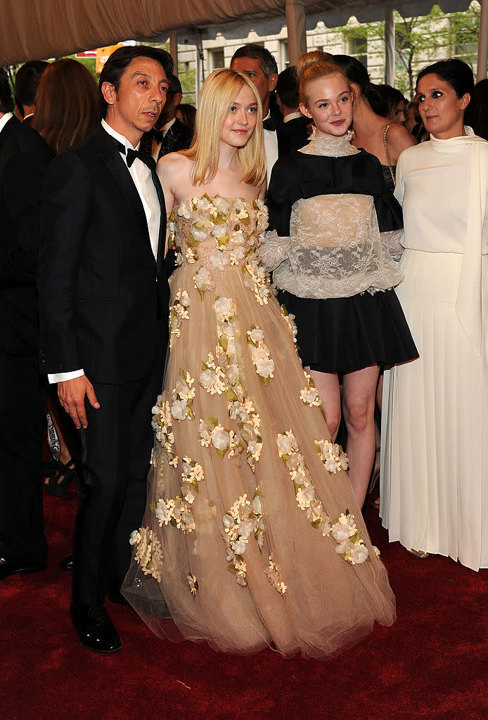 Pierpaolo Piccioli of Valentino, actresses Dakota Fanning, Elle Fanning and designer Maria Grazia Chiuri of Valentino attend the "Alexander McQueen: Savage Beauty" Costume Institute Gala at The Metropolitan Museum of Art on May 2, 2011 in New York City.