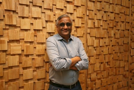 Kishore Biyani, CEO and founder of India's Future Group poses after the inauguration of Foodhall, a premium lifestyle food superstore by the Future Group, store in Mumbai