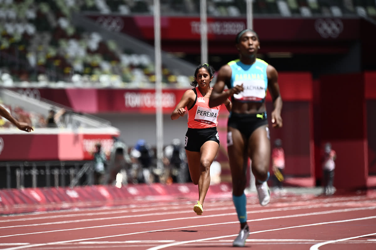 Singapore's Veronica Shanti Pereira (left) competes in the women's 200m heats during the 2020 Tokyo Olympics. (PHOTO: Jewel Samad/AFP)