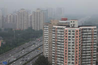 Residential buildings are seen along the Fourth Ring Road in Beijing, China July 16, 2018. REUTERS/Jason Lee