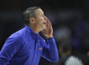 Florida coach Mike White shouts to players during the first half of the team's NCAA college basketball game against Alabama on Wednesday, Jan. 5, 2022, in Gainesville, Fla. (AP Photo/Matt Stamey)