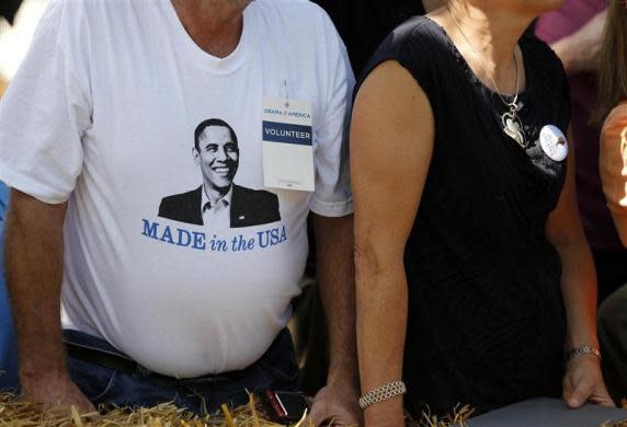 Supporters listen to President Barack Obama talk at a campaign event at the Nelson Pioneer Farm and Museum in Oskaloosa, Iowa, August 14, 2012.