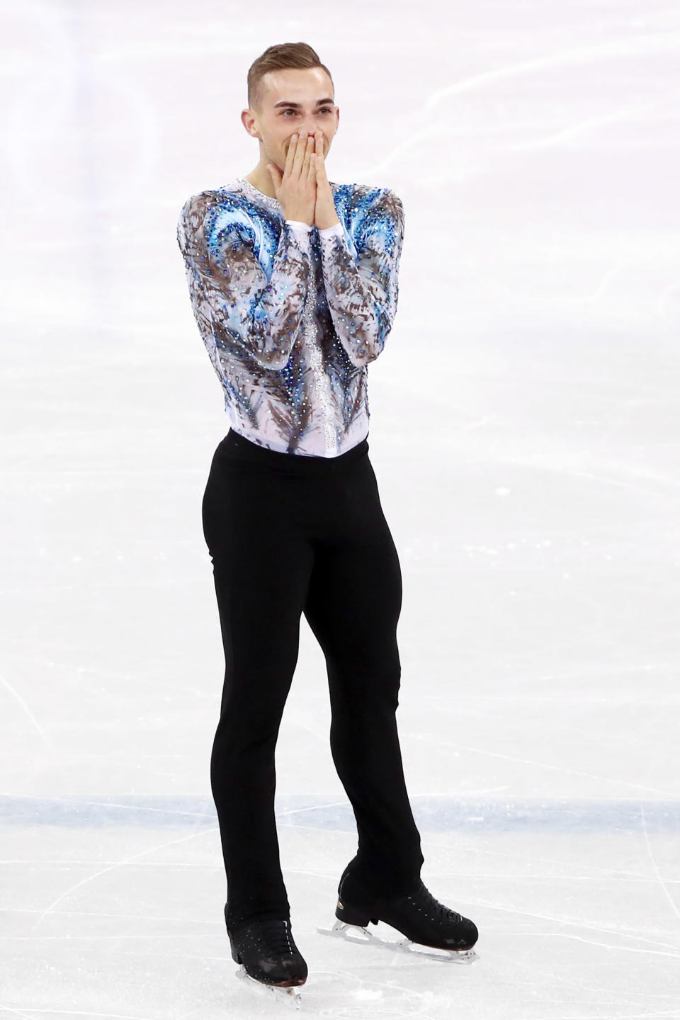 <p>Adam Rippon of the United States reacts after completing a stunning free skate during the figure skating team competition.</p>