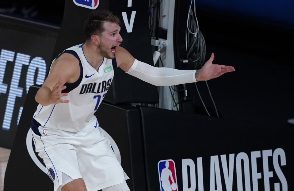 Dallas Mavericks' Luka Doncic (77) pleads with a referee during the second half of an NBA first round playoff game against the Los Angeles Clippers Sunday, Aug. 30, 2020, in Lake Buena Vista, Fla. (AP Photo/Ashley Landis)