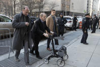 Harvey Weinstein, second from left, arrives at court for his trial on charges of rape and sexual assault, Friday, Jan. 24, 2020, in New York. (AP Photo/Mark Lennihan)