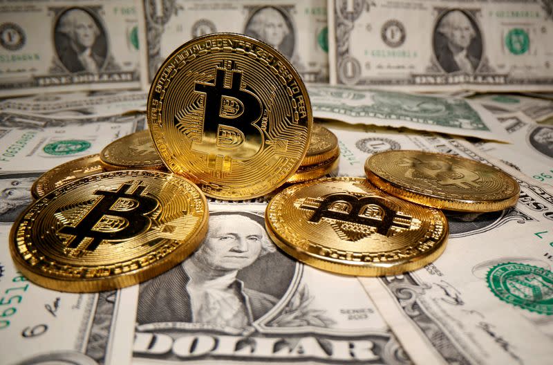 FILE PHOTO: Representations of virtual currency Bitcoin are placed on U.S. Dollar banknotes