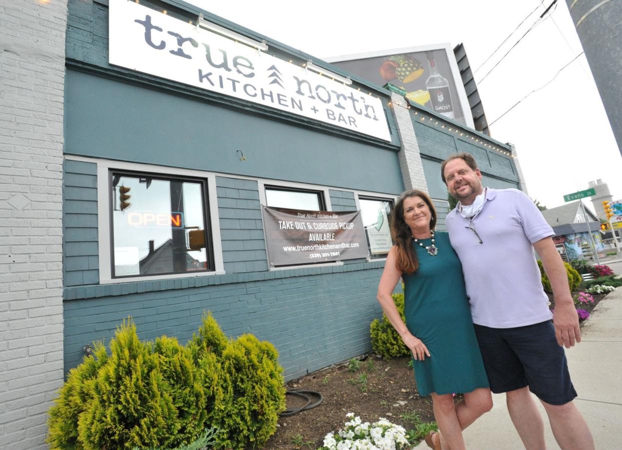 True North Kitchen & Bar owners Janet and Joe Campbell stand in front of their North Weymouth restaurant in July 2020.