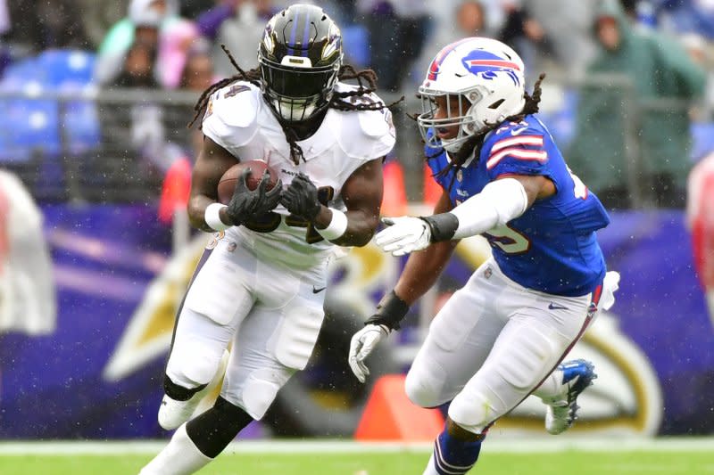 Former Baltimore Ravens running back Alex Collins (L) appeared in 50 career NFL games. File Photo by Kevin Dietsch/UPI