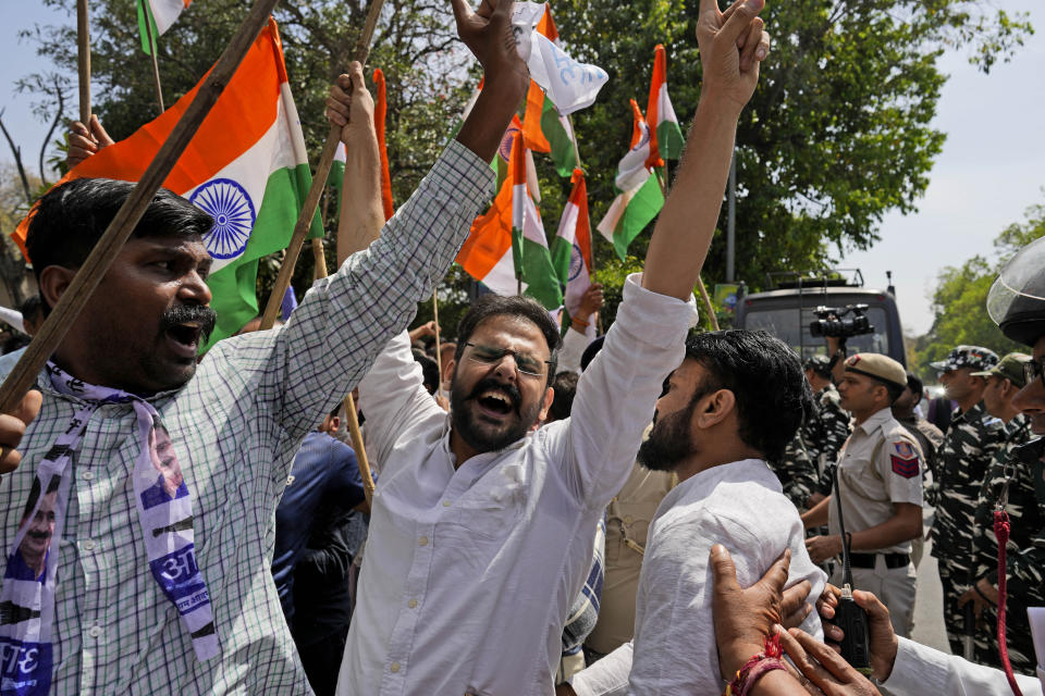 Members of Aam Admi Party, or Common Man's Party, shout slogans during a protest against the arrest of their party leader Arvind Kejriwal in New Delhi, India, Tuesday, March 26, 2024. Indian police have detained dozens of opposition protesters and prevented them from marching to Prime Minister Narendra Modi’s residence to demand the release of their leader and top elected official of New Delhi who was arrested last week in a liquor bribery case. (AP Photo/Manish Swarup)