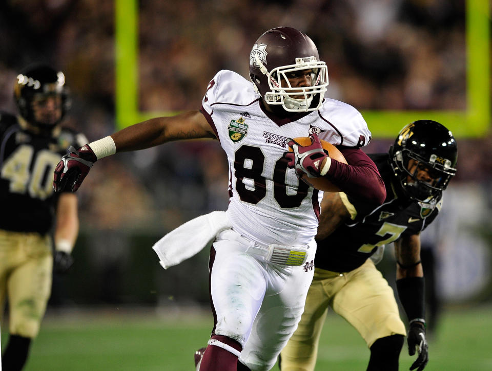 NASHVILLE, TN - DECEMBER 30: Malcolm Johnson #80 of the Mississippi State Bulldogs breaks away from defender Merrill Noel #7 of the Wake Forest Demon Deacons during play at the Franklin American Mortgage Music City Bowl at LP Field on December 30, 2011 in Nashville, Tennessee. (Photo by Grant Halverson/Getty Images)