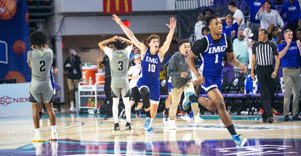 The  IMG Academy dunks celebrates  against Prolific Prep in GEICO High School Nationals quarterfinal game ay Suncoast Credit Union Arena on Thursday. 