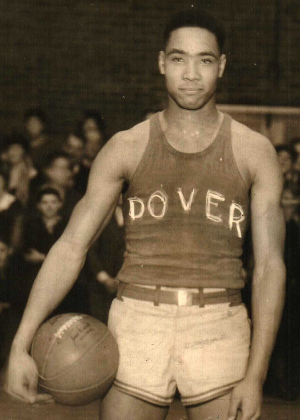 Doc Kelker was the first Dover player to be selected All-Ohio in football and basketball (1933) and the first athlete to win both a state football and basketball title. This photo was taken on January 20, 1934 after Doc's final game on what was called Doc Kelker Night in Memorial Hall. 1,200 fans crammed into the gym to salute  their hero after a four-year career